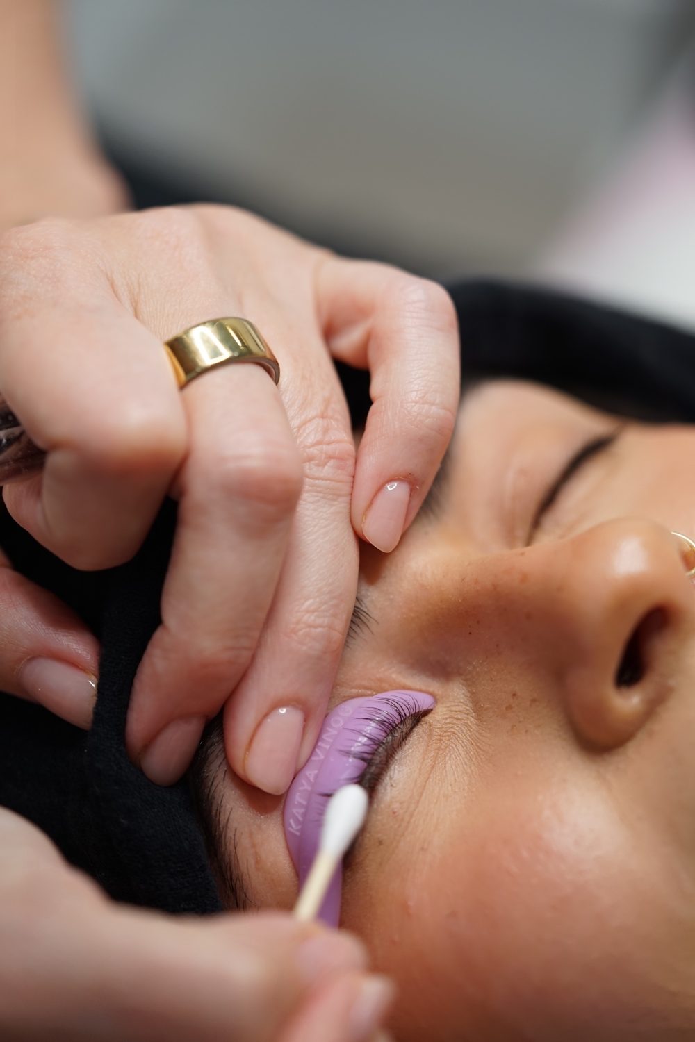 Close-up of a lash artist at work during a content day
